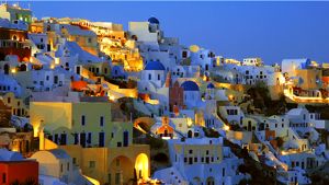 A typical Chora on a Cyclades island as the afternoon sun sets and the evening lights come on