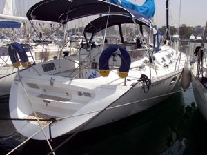 A Sun Magic 44 sailing yacht available for flotilla sailing holidays and bareboat charter sits waiting at the Poros quayside yacht base of Greek Sails