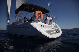 A Greek Sails Sun Odyssey 36i sailing yacht making way during a flotilla sailing holiday from Poros, Greece