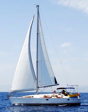 A Greek Sails Sun Odyssey 37.1 sailing yacht underway during a flotilla sailing holiday from Poros, Greece