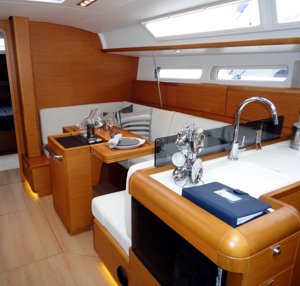 The Sun Odyssey 409 has a light, spacious & bright main saloon with good seating and an adaptable table that can be lowered to make an additional double berth, or ‘folded over’ to extend out across the entire cabin width and seat more people