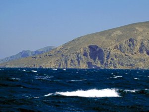 Sailing the Cyclades islands in the Aegean with the Meltemi wind blowing