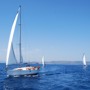 Yachts on flotilla sailing together during a flotilla holiday, Poros, Greece