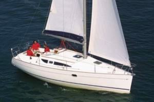 A Sun Odyssey 32 sailing yacht underway