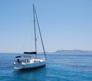 A Greek Sails yacht at anchor looking out across the Hydra channel during a flotilla sailing holiday, Greece